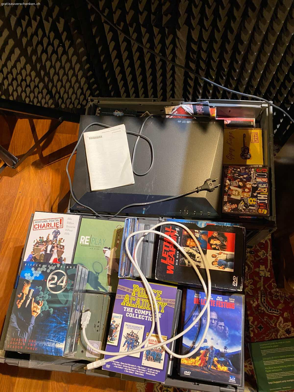 100+ CDs und DVDs mit DVD Player und kisten. Cds und dvds