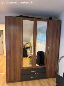 Kleiderschrank gebraucht. Wir verschenken einen gebrauchten Kleiderschrank, er hat einige kleinere Gebrauchsspuren (siehe Fotos), aber funktioniert noch einwandfrei. 
2x Spiegeltüren 
2x Fächer für Socken etc.
Mehrere Fächer und eine Stange zum Kleider aufhängen. 
Breite: 180 cm
Tiefe: 55 cm
Höhe: 210 cm 

Der Schrank befindet sich im 4.OG einer Altbauwohnung OHNE LIFT, nur Selbstabholung.